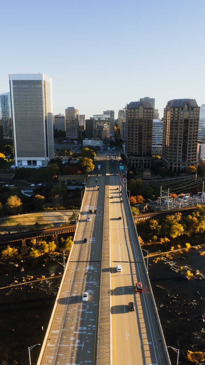 Aerial view of downtown Richmond, Virginia featuring prominent skyscrapers and a river.